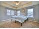 Sun-filled main bedroom features plush carpeting, tray ceiling, and generous natural light from multiple windows at 9445 E 106Th Pl, Commerce City, CO 80640