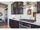 Modern kitchen featuring sleek cabinets, stainless steel appliances, and stylish backsplash at 17577 W 87Th Ave, Arvada, CO 80007