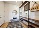 Functional mud room with storage shelves, bench, and stylish decor at 17577 W 87Th Ave, Arvada, CO 80007