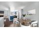 Cozy dining area with modern chairs and adjacent kitchen at 4025 S Fundy Way, Aurora, CO 80013