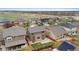 Backyard aerial view of residences near scenic open space with lush green fields at 16685 E 101St Ave, Commerce City, CO 80022