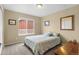 Cozy bedroom with carpeted floors, a window, and a double bed, offering a comfortable and inviting space at 16685 E 101St Ave, Commerce City, CO 80022