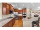 Modern kitchen featuring stainless steel appliances, granite countertops, and hardwood floors at 16685 E 101St Ave, Commerce City, CO 80022