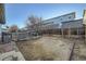 Image showcasing a backyard with a partial fence line and a compact dirt area at 11039 Columbine St, Northglenn, CO 80233