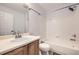 An updated bathroom with a bathtub and shower combination and a single sink vanity at 11039 Columbine St, Northglenn, CO 80233