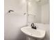 Bathroom featuring a modern sink with dark fixtures and bright white walls at 11039 Columbine St, Northglenn, CO 80233