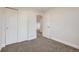 This bedroom features plush carpeting and a closet with sliding doors at 11039 Columbine St, Northglenn, CO 80233