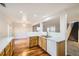 Bright kitchen with white countertops, wood cabinets, and stainless steel appliances at 11039 Columbine St, Northglenn, CO 80233