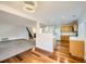 Open-concept living room featuring carpet and wood flooring and a modern light fixture at 11039 Columbine St, Northglenn, CO 80233