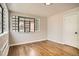 Bright bedroom features hardwood floors, modern light fixture, and windows letting in natural light at 1000 E 8Th Ave # 4, Denver, CO 80218