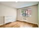 This bedroom boasts natural light, hardwood floors, and closet space at 1000 E 8Th Ave # 4, Denver, CO 80218