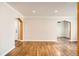 Bright living room boasts hardwood floors, classic trim, and arched entrances for a welcoming, open layout at 1000 E 8Th Ave # 4, Denver, CO 80218