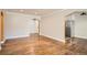Open-concept living room features hardwood floors, arched doorways, and neutral paint, creating an inviting space at 1000 E 8Th Ave # 4, Denver, CO 80218