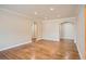 Expansive living area with hardwood floors, white trim, arched doorways, and recessed lighting, perfect for modern living at 1000 E 8Th Ave # 4, Denver, CO 80218