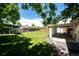 Lush, green backyard with a well-maintained lawn, perfect for outdoor activities and relaxation at 1183 S Umatilla St, Denver, CO 80223