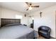 Nicely decorated bedroom featuring a ceiling fan and hardwood floors at 1183 S Umatilla St, Denver, CO 80223