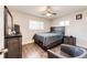 Nicely decorated bedroom featuring a ceiling fan and hardwood floors at 1183 S Umatilla St, Denver, CO 80223