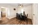 Bright dining room featuring hardwood floors and modern ceiling fan at 1183 S Umatilla St, Denver, CO 80223