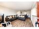 Spacious living room featuring hardwood floors and an open-concept layout at 1183 S Umatilla St, Denver, CO 80223