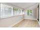 Bright sun room with lots of windows to bring natural light to the space at 1183 S Umatilla St, Denver, CO 80223