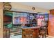 Finished basement featuring custom bar with wood accents and barstool seating at 6420 Agave Ave, Castle Rock, CO 80108