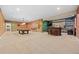 Expansive basement with a pool table and wet bar, perfect for recreation and hosting gatherings at 6420 Agave Ave, Castle Rock, CO 80108