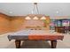 Pool table with American flag cover adds character to this basement at 6420 Agave Ave, Castle Rock, CO 80108