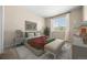 Comfortable bedroom featuring a large window with backyard views and neutral paint at 6420 Agave Ave, Castle Rock, CO 80108