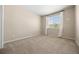 Spacious bedroom features neutral carpet, a large window with bright natural light, and ample space at 6420 Agave Ave, Castle Rock, CO 80108