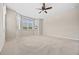 Bright bedroom with large windows, plush carpeting and a ceiling fan at 6420 Agave Ave, Castle Rock, CO 80108