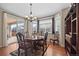 Cozy breakfast nook featuring hardwood floors, a chandelier, natural light, and sliding glass doors to the patio at 6420 Agave Ave, Castle Rock, CO 80108