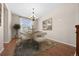 Chic dining area with modern chandelier, hardwood floors, and elegant decor at 6420 Agave Ave, Castle Rock, CO 80108