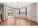 Bright dining room featuring hardwood floors, large windows, and a sliding door to an outdoor patio at 6420 Agave Ave, Castle Rock, CO 80108