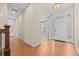 Bright entryway featuring hardwood floors, a decorative front door, and access to the main living areas at 6420 Agave Ave, Castle Rock, CO 80108