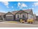 Charming single-story home with a two car garage, landscaped front yard, and an inviting front porch seating area at 6420 Agave Ave, Castle Rock, CO 80108