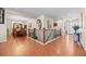 Spacious hallway with hardwood floors connecting the dining room and front entrance, showcasing the open layout at 6420 Agave Ave, Castle Rock, CO 80108