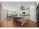 Open kitchen features a large island, white cabinets, and stainless steel appliances at 6420 Agave Ave, Castle Rock, CO 80108