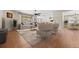 Bright living room with hardwood flooring, modern furniture, and open concept design at 6420 Agave Ave, Castle Rock, CO 80108