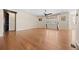 Spacious living room featuring hardwood floors, a ceiling fan, and plenty of natural light from the large window at 6420 Agave Ave, Castle Rock, CO 80108