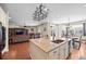 Spacious island connecting the kitchen to the living room, with a view to the outdoor dining area and large sectional at 6420 Agave Ave, Castle Rock, CO 80108