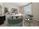 Bright office space offers modern decor, a large desk and a window with neighborhood views at 6420 Agave Ave, Castle Rock, CO 80108