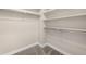 Spacious walk-in closet with custom shelving and hanging rods at 6230 Florence Way, Denver, CO 80238