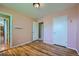 Bedroom with hardwood floors, neutral walls and access to additional rooms at 1060 S Coffman St, Longmont, CO 80501