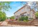 Backyard with a multi-tiered deck and lush landscaping at 9432 La Quinta Way, Lone Tree, CO 80124