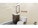 Cozy half bathroom featuring a modern vanity and stylish slate tile flooring at 9432 La Quinta Way, Lone Tree, CO 80124