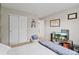 This bedroom is highlighted by neutral walls and carpet, and sliding door closet at 9432 La Quinta Way, Lone Tree, CO 80124