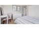 Bedroom featuring a white dresser, framed art and a large closet at 9432 La Quinta Way, Lone Tree, CO 80124