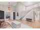 Spacious foyer with staircase and hardwood floors, leading into the dining area at 9432 La Quinta Way, Lone Tree, CO 80124
