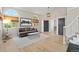 Bright living room with hardwood floors, large windows, and modern decor, offering a comfortable living space at 9432 La Quinta Way, Lone Tree, CO 80124