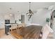 Open concept living space features hardwood floors, lots of natural light and a modern kitchen at 9432 La Quinta Way, Lone Tree, CO 80124